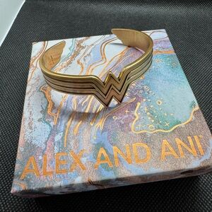 - Alex and Ani Gold Tone Retired Wonder Woman Cuff with bid - never worn